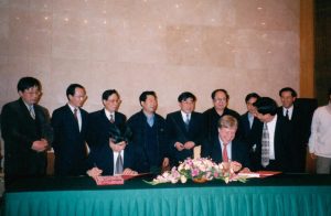 Peter Brightman signing a cultural and Arts agreement in Beijing, China.